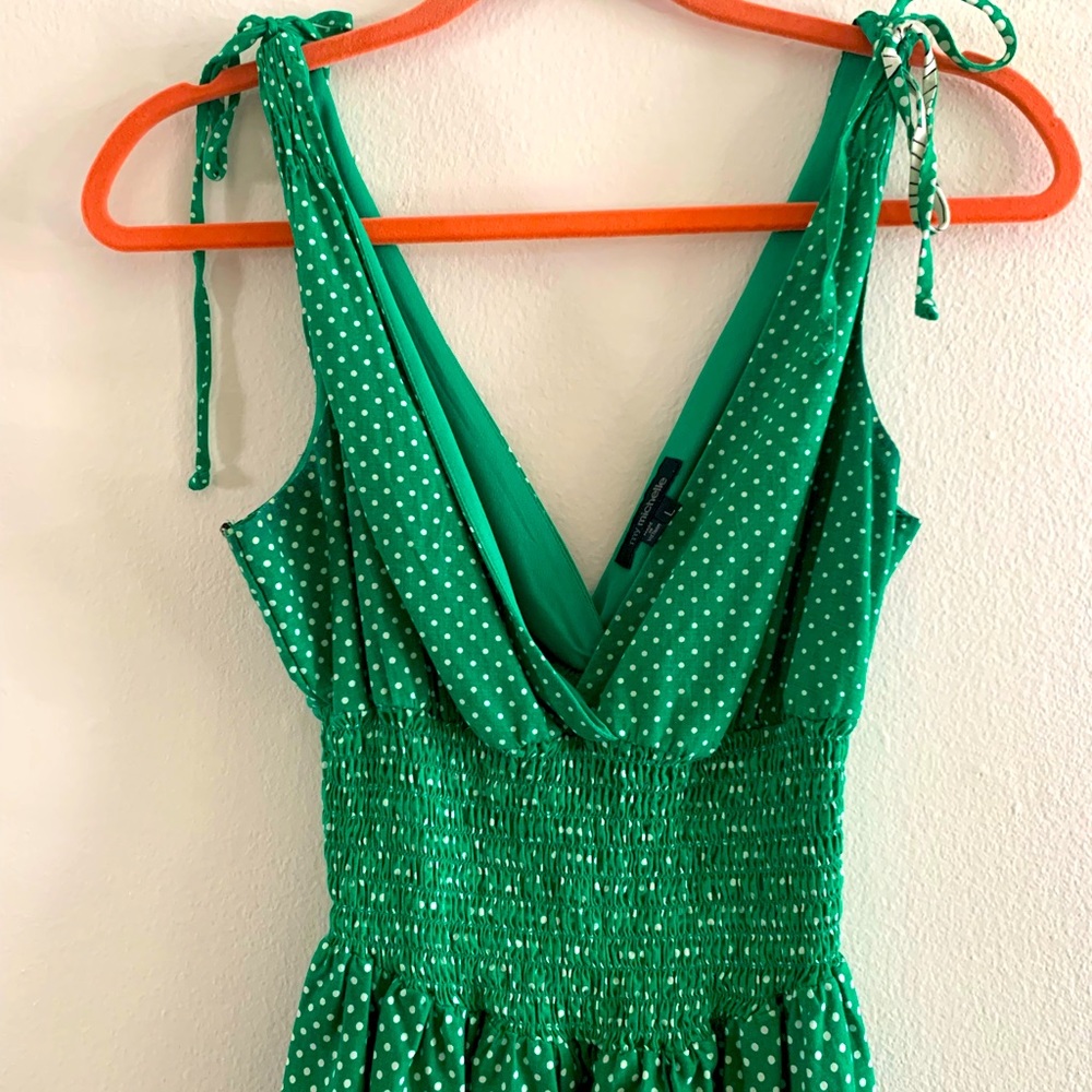 Cute green with cream color and some black. Super cute on. Bust is roomy.